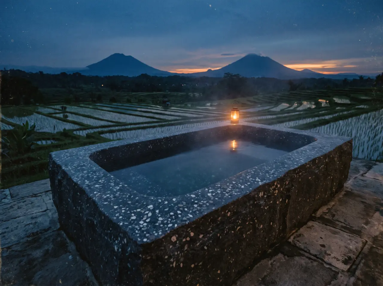 Bak es terrazzo di halaman rumah Magelang dengan siluet Merapi di latar belakang